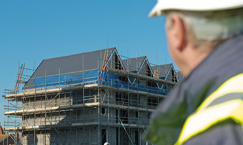 Man looking at a construction site